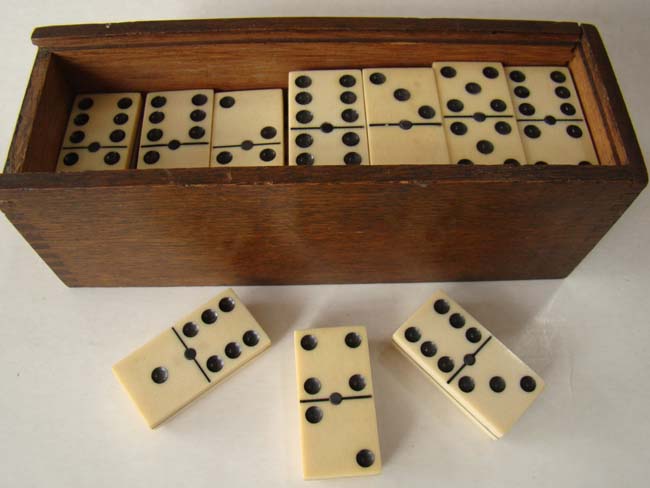 A fabulous set of large and thick all bone dominoes in a box dated 1919 with inscription